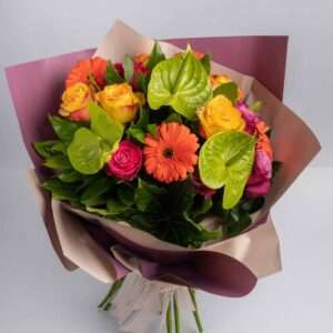 Bouquet of yellow roses and orange gerberas